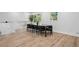 Open dining area with hardwood floors and lots of natural light from nearby windows at 4745 Elam Forest Dr, Stone Mountain, GA 30083