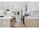 Gourmet kitchen featuring an island with a sink, a tile backsplash, and modern appliances at 4745 Elam Forest Dr, Stone Mountain, GA 30083