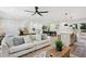 Bright and airy living room featuring a modern ceiling fan and open-concept design at 4745 Elam Forest Dr, Stone Mountain, GA 30083