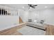 Comfortable living room with open staircase, a neutral sofa, and stylish rug at 4745 Elam Forest Dr, Stone Mountain, GA 30083