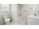 Bright bathroom featuring a toilet, sink, bathtub and natural light at 1624 Glenfield Dr, Lawrenceville, GA 30043
