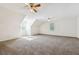Spacious carpeted bedroom with window and two ceiling fans, bathed in natural light at 1624 Glenfield Dr, Lawrenceville, GA 30043