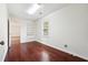 Office features hardwood floors, window, and shelving at 1624 Glenfield Dr, Lawrenceville, GA 30043