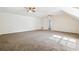 Spacious bedroom featuring neutral carpet, ceiling fans, and ample natural light at 1624 Glenfield Dr, Lawrenceville, GA 30043