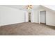 Spacious carpeted bedroom with window, ceiling fan, and closet at 1624 Glenfield Dr, Lawrenceville, GA 30043