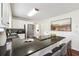 Kitchen features granite countertops, stainless steel appliances, and an island with a breakfast bar at 1624 Glenfield Dr, Lawrenceville, GA 30043