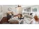 Cozy living room features hardwood floors, a fireplace, and ample natural light at 1624 Glenfield Dr, Lawrenceville, GA 30043