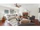 Cozy living room features hardwood floors, a fireplace, and ample natural light at 1624 Glenfield Dr, Lawrenceville, GA 30043