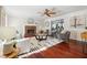 Cozy living room features hardwood floors, a fireplace, and ample natural light at 1624 Glenfield Dr, Lawrenceville, GA 30043