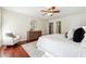 Bright main bedroom with ceiling fan, hardwood floors, modern decor, and lots of natural light at 1624 Glenfield Dr, Lawrenceville, GA 30043