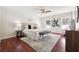 Spacious main bedroom with ceiling fan, hardwood floors, lots of natural light and modern decor at 1624 Glenfield Dr, Lawrenceville, GA 30043