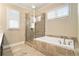 Bathroom showcasing a glass enclosed shower and large soaking tub at 169 Waterman Se St, Marietta, GA 30060