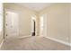 Neutral bedroom featuring plush carpet, ample natural light, and a convenient walk-in closet at 169 Waterman Se St, Marietta, GA 30060