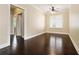 Bedroom featuring dark hardwood flooring, ceiling fan and bright windows at 169 Waterman Se St, Marietta, GA 30060