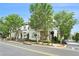 Street view showcasing a well-manicured, light-colored two-story home, lush trees, and neighborhood charm at 169 Waterman Se St, Marietta, GA 30060