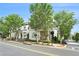 Street view of a quaint two-story home with mature trees enhancing its curb appeal on a sunny day with blue skies at 169 Waterman Se St, Marietta, GA 30060