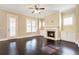 Cozy living room boasts a fireplace, hardwood floors, and a door to the outside at 169 Waterman Se St, Marietta, GA 30060