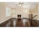 Bright living room features a fireplace, built-in cabinets, hardwood floors, and plantation shutters at 169 Waterman Se St, Marietta, GA 30060