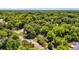 Scenic aerial view of a neighborhood surrounded by lush greenery and mature trees on a sunny day at 1834 Broad Ave, Atlanta, GA 30344