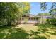 The backyard reveals a well-maintained lawn and the rear exterior of the residence at 1834 Broad Ave, Atlanta, GA 30344