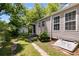 The backyard shows the home's exterior, a detached garage, and a stone driveway at 1834 Broad Ave, Atlanta, GA 30344