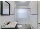 Full bathroom with tiled walls, vanity and a bathtub with shower at 1834 Broad Ave, Atlanta, GA 30344