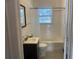 Bathroom featuring shower with curtain, subway tile, patterned flooring, and dark vanity at 1834 Broad Ave, Atlanta, GA 30344