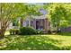 Charming home featuring a screened porch, brick pillars, lovely landscaping and a well-manicured lawn at 1834 Broad Ave, Atlanta, GA 30344