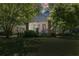 Charming home featuring a screened porch, brick pillars, lovely landscaping and a well-manicured lawn at 1834 Broad Ave, Atlanta, GA 30344
