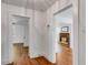 Hallway with hardwood floors and access to different rooms at 1834 Broad Ave, Atlanta, GA 30344