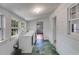 Laundry room with washer, dryer, and windows providing natural light at 1834 Broad Ave, Atlanta, GA 30344