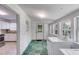 Bright laundry room featuring washing machine, dryer and multiple windows at 1834 Broad Ave, Atlanta, GA 30344