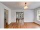 Bright living room with hardwood floors, white walls, and natural light from the window at 1834 Broad Ave, Atlanta, GA 30344
