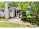 Rear view of home with a screen door, brick details, siding and lush green grass at 1834 Broad Ave, Atlanta, GA 30344