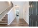 Inviting foyer with hardwood floors, staircase, and open view to living area, creating a welcoming entrance at 2039 Wildflower Nw Way, Conyers, GA 30012