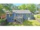 Backyard with a deck, stairs, lush green lawn, and a privacy fence at 2437 N Decatur Rd, Decatur, GA 30033
