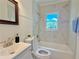 Bathroom featuring marble tile, a shower with a tub and a blue towel at 2437 N Decatur Rd, Decatur, GA 30033