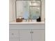 Bright bathroom features a white vanity with a black framed mirror and shower with glass doors at 2437 N Decatur Rd, Decatur, GA 30033