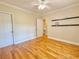 Bright bedroom with a ceiling fan, hardwood floors and modern shelving at 2437 N Decatur Rd, Decatur, GA 30033