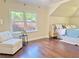 Comfortable bedroom with hardwood floors, a cozy chair, and large windows at 2437 N Decatur Rd, Decatur, GA 30033