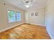 Spacious bedroom with hardwood floors, a ceiling fan and two windows at 2437 N Decatur Rd, Decatur, GA 30033