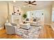 Spacious living room with a fireplace, hardwood floors, and stylish neutral-toned decor at 2437 N Decatur Rd, Decatur, GA 30033