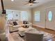 Bright and airy living room with hardwood floors, fireplace, and stylish furnishings at 2437 N Decatur Rd, Decatur, GA 30033