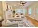 Open-concept living room with hardwood floors, fireplace, and stylish decor at 2437 N Decatur Rd, Decatur, GA 30033