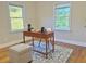 Bright room features a modern desk, hardwood floors and two large windows at 2437 N Decatur Rd, Decatur, GA 30033