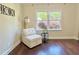 A cozy chair sits in the bedroom near a window and side table at 2437 N Decatur Rd, Decatur, GA 30033
