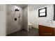 Sleek bathroom with a glass-enclosed shower, dual vanity, and contemporary fixtures at 458 Shannon Sw Dr, Atlanta, GA 30310
