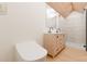 Modern bathroom featuring a double vanity and frameless glass shower, enhanced by warm wood accents at 458 Shannon Sw Dr, Atlanta, GA 30310