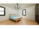 Bright bedroom with hardwood floors, neutral walls, and a comfortable bed at 458 Shannon Sw Dr, Atlanta, GA 30310