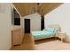 Charming bedroom with a vaulted wooden ceiling, sleek TV, and a minimalist aesthetic at 458 Shannon Sw Dr, Atlanta, GA 30310